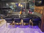Black restaurant chair with faux marble restaurant table